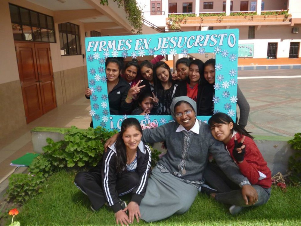 Franciscan Missionary of Mary Sr. Marian Champika Hanzege poses for a photo with girls at Immaculate College in Abancay, Peru, in 2011. (Provided photo)