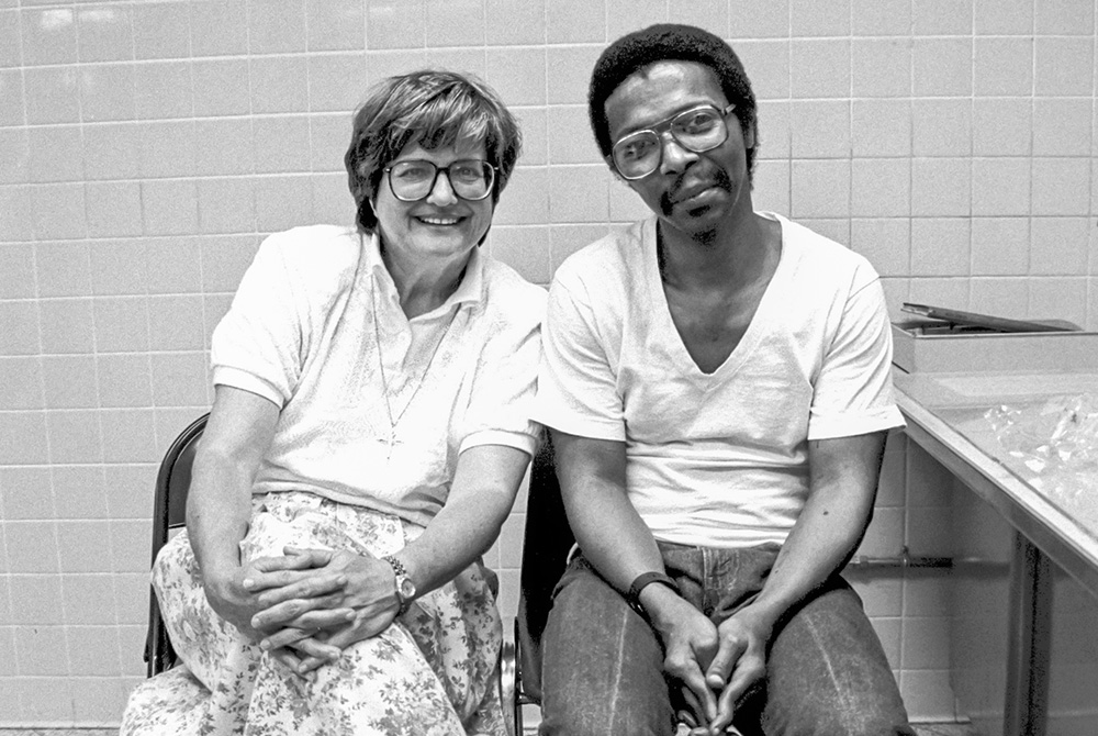 Sr. Helen Prejean with death row inmate Dobie Gillis Williams at Angola State Penitentiary in Louisiana in 1999. Williams was executed that same year. (Courtesy of Ministry Against the Death Penalty/Joup Bouma)