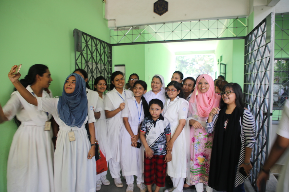 Happier times: the students at Holy Cross College take a group photo before the COVID-19 pandemic. (Sumon Corraya)