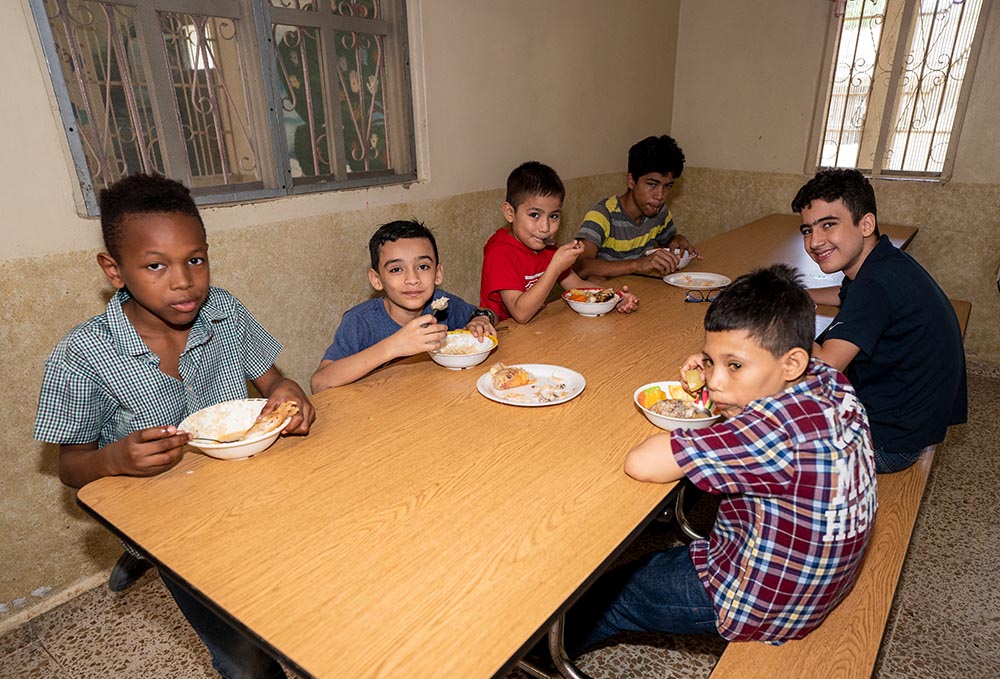 Boys eat lunch at Casa Corazón de la Misericordia orphanage for HIV-positive children in San Pedro Sula, Honduras. (Gregg Brekke)