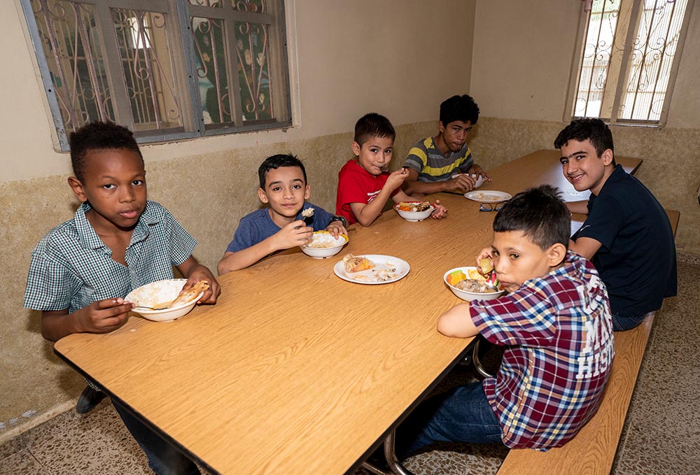 Boys eat lunch at Casa Corazón de la Misericordia orphanage for HIV-positive children in San Pedro Sula, Honduras. (Gregg Brekke) Boys eat lunch at Casa Corazón de la Misericordia orphanage for HIV-positive children in San Pedro Sula, Honduras. (Gregg Brekke)
