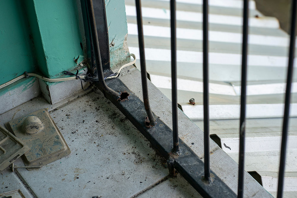 Srs. Victoria Emérita and Milena Vanegas broke the welds on two security bars of their patio and spread them apart to get to waiting rescue boats in La Planeta, a neighborhood of La Lima, Honduras. (Gregg Brekke)