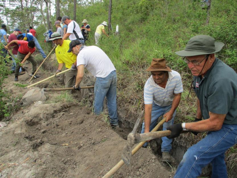 Sister Water Project volunteers install pipes to complete a 19-mile water project in the Honduran village of Mejocote, August 2018.