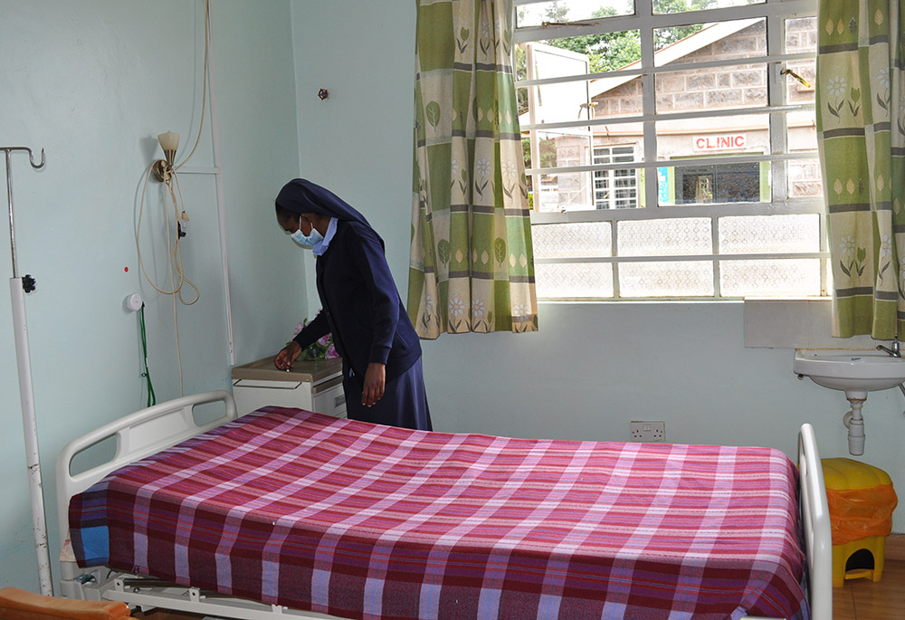 Sr. Mary Mukui goes over a patient's room in the hospice. The hospice currently has seven patients receiving palliative care. (Lourine Oluoch)