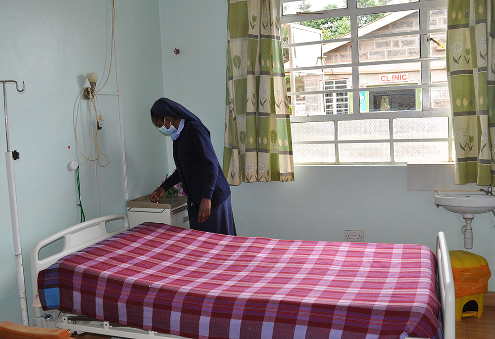Sr. Mary Mukui goes over a patient's room in the hospice. The hospice currently has seven patients receiving palliative care. (Lourine Oluoch) Sr. Mary Mukui goes over a patient's room in the hospice. The hospice currently has seven patients receiving palliative care. (Lourine Oluoch)