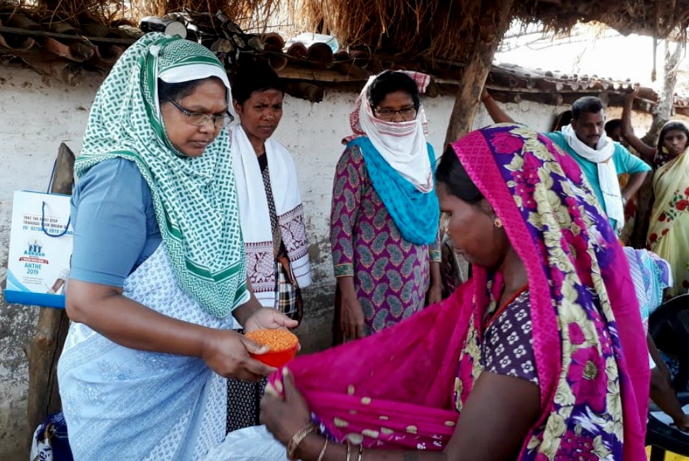 From left: Sr. Josephine Kisku, Sr. Sushma Ekka and Sr. Susan Tudu, all Sisters of Charity of Nazareth, distribute food in Chatra, India. (Courtesy of the Sisters of Charity of Nazareth)