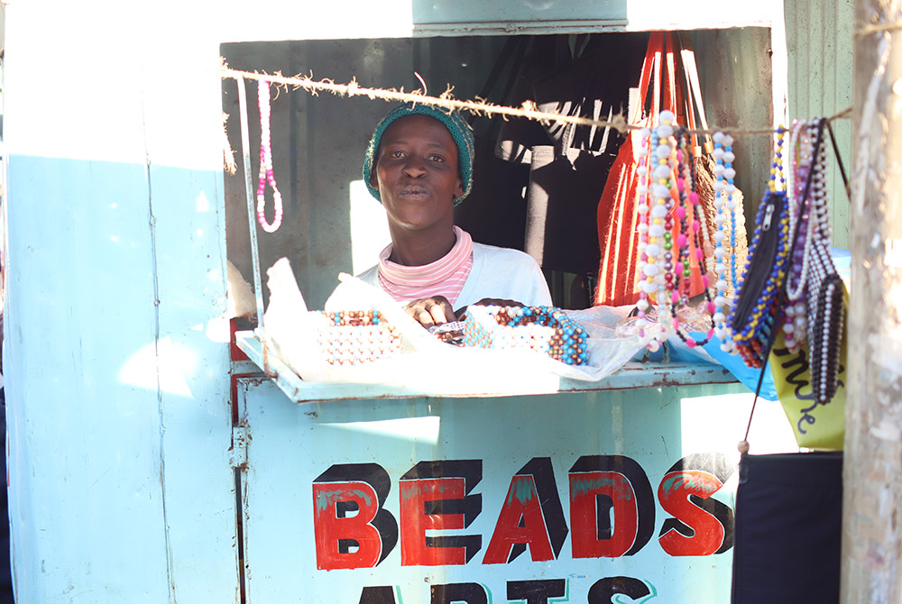 Mary Wanjiku, 26, is pictured inside her beadwork shop along a busy junction in Limuru, a town in central Kenya. (Wycliff Oundo) Mary Wanjiku, 26, is pictured inside her beadwork shop along a busy junction in Limuru, a town in central Kenya. (Wycliff Oundo)