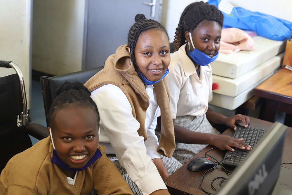Girls from the computer literacy class showcase their skills in a computer room at Limuru Cheshire Home, a charitable institution for girls living with physical and intellectual disabilities in Kenya. (Wycliff Oundo)