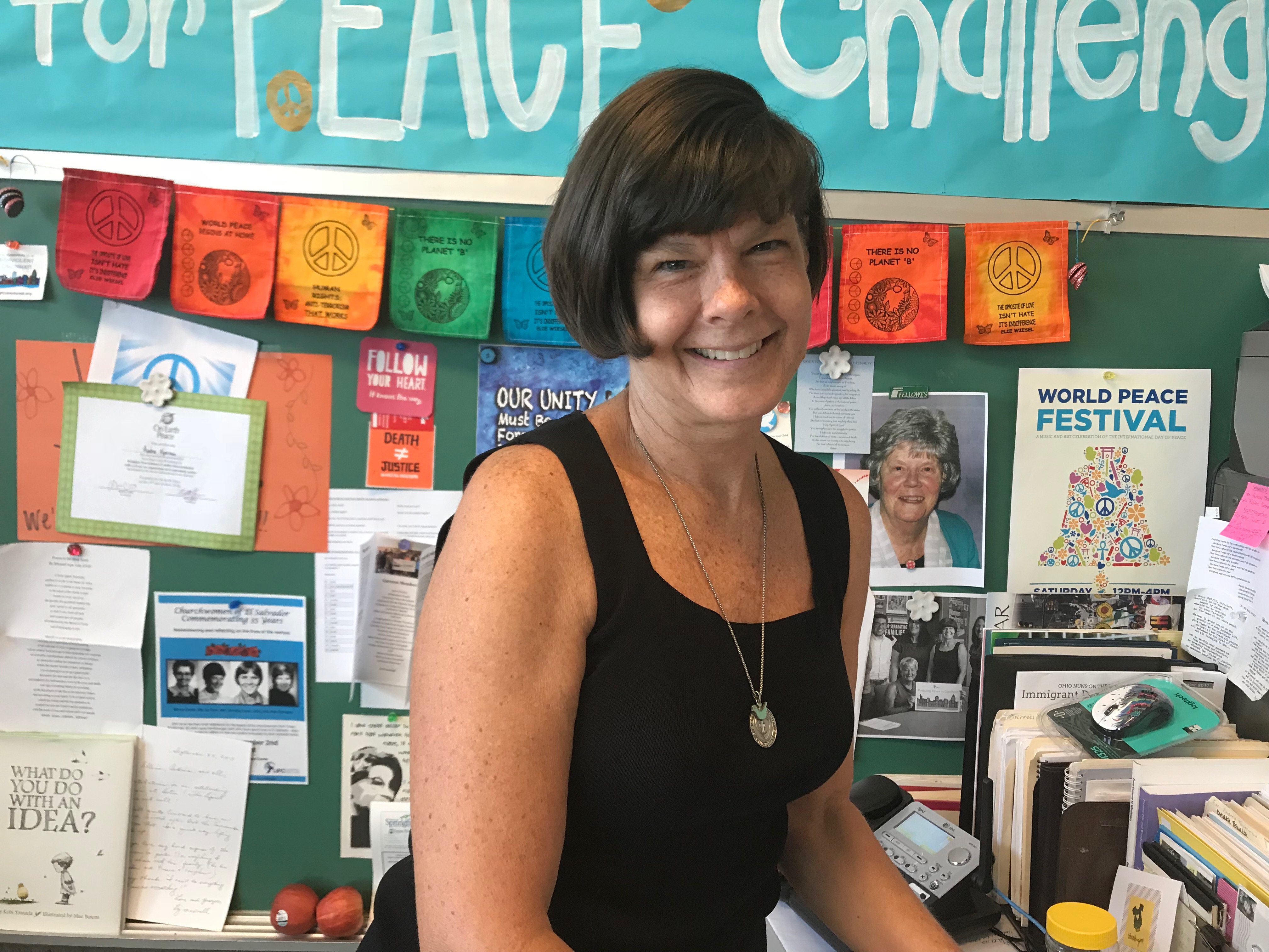 Charity Sr. Andrea Koverman at her desk at the Intercommunity Justice and Peace Center.