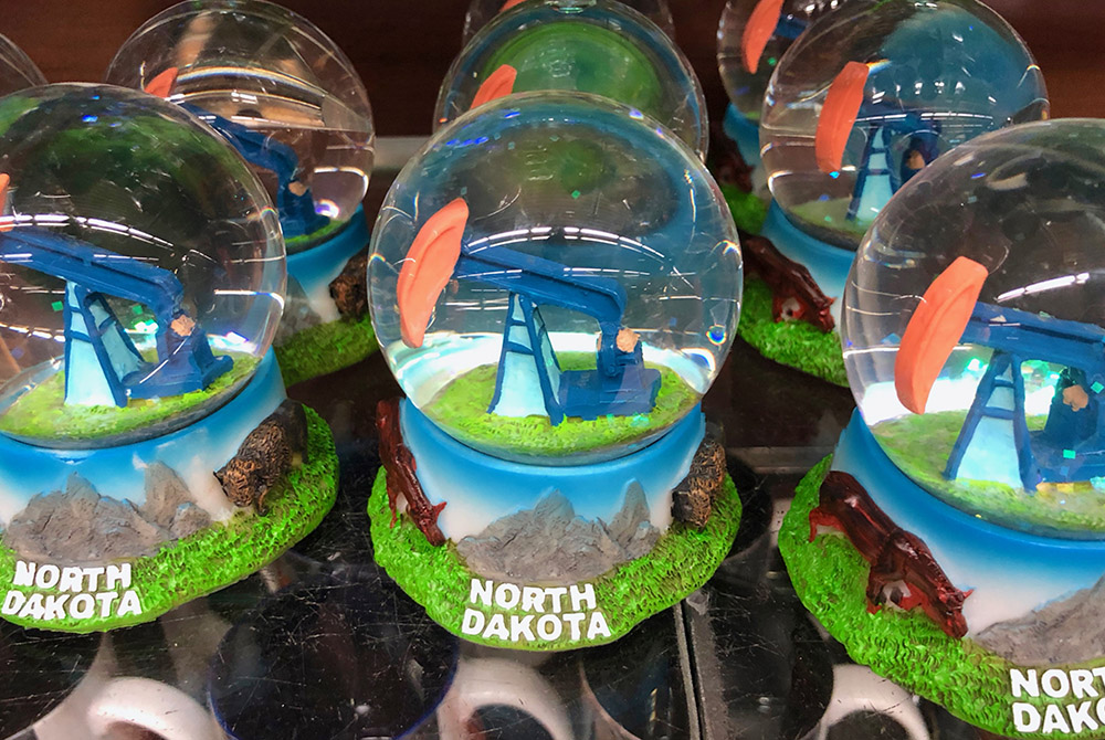 Snow globes for sale in the Fargo, North Dakota, airport gift shop highlight the state's oil industry. (GSR photo/Dan Stockman)