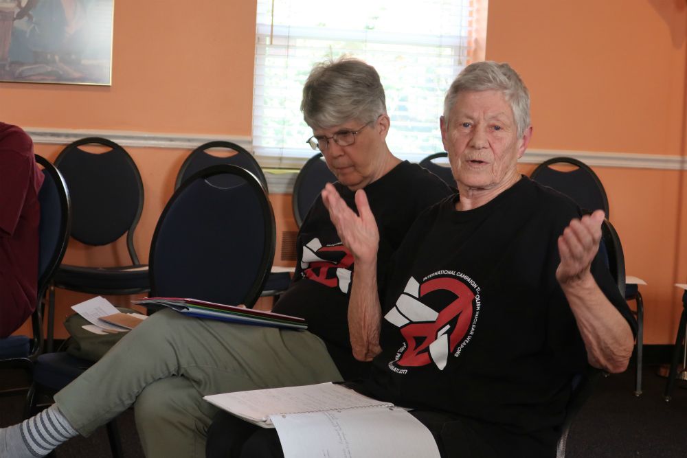 Sr. Carol Gilbert, left, and Sr. Ardeth Platte teach a workshop on the ban treaty at the Óscar Romero Center in Camden, New Jersey in August 2019. (Claire Schaeffer-Duffy)