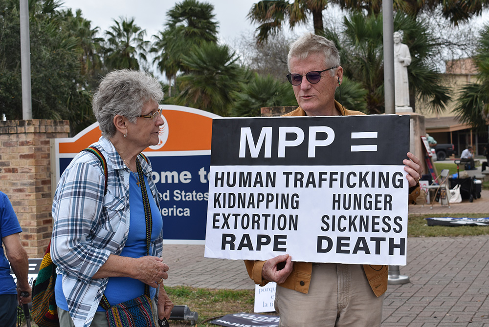 Notre Dame de Namur Sr. Mary Alice McCabe and a member of Witness and the Border protest the Migrant Protection Protocols on the Brownsville, Texas, side of the bridge to Matamoros, Mexico, in 2019. (Courtesy of Mary Alice McCabe)