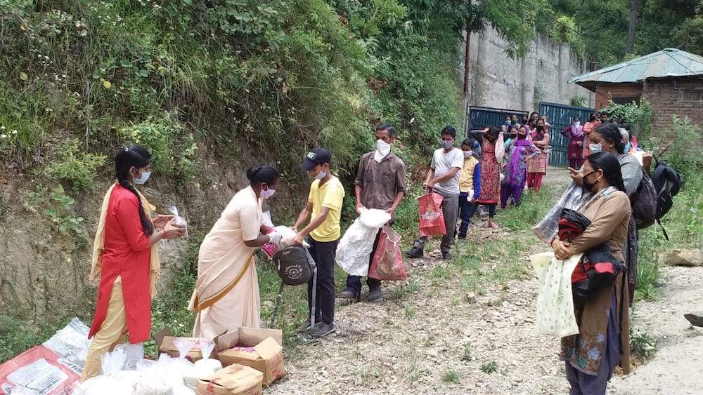 Sisters also reached out to help migrants. Sisters of the Little Flower of Bethany distribute provisions to migrants in Himachal Pradesh, in the north India (Courtesy Women's Religious Conference India)