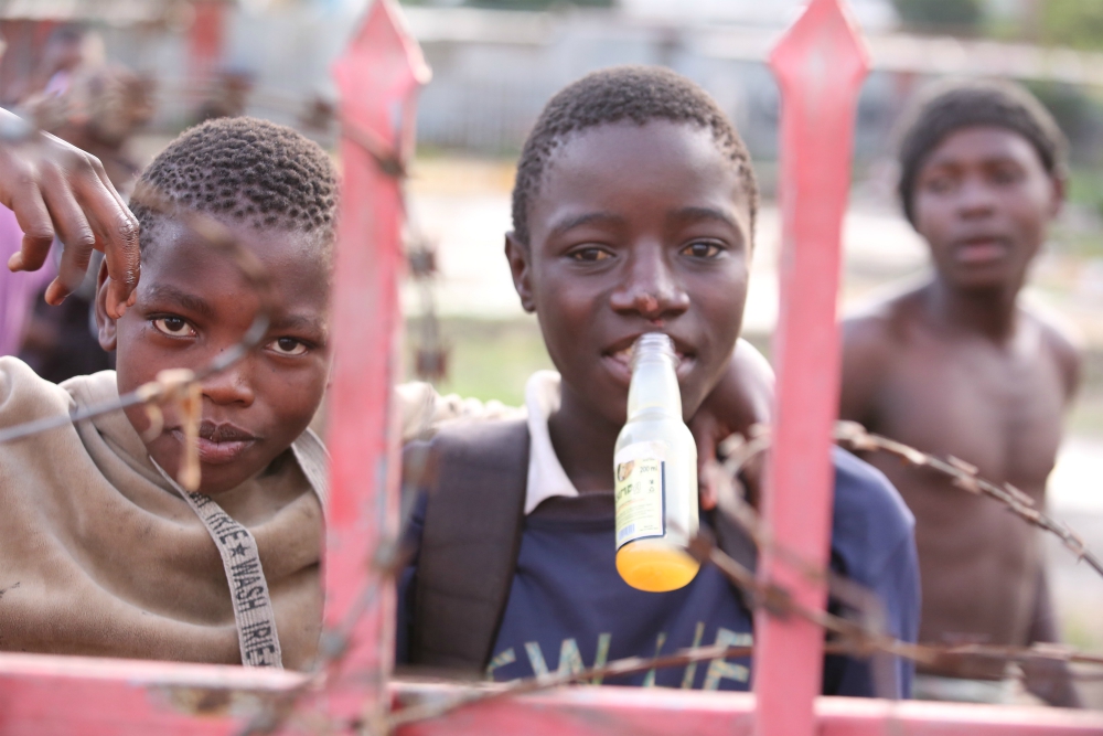 A homeless boy sniffs toxic glue on the streets of Nairobi, Kenya. Street children do this to beat hunger pangs, stay warm and feel good from the high, but health officials warn that glue sniffing presents a serious danger to them. (Doreen Ajiambo) A homeless boy sniffs toxic glue on the streets of Nairobi, Kenya. Street children do this to beat hunger pangs, stay warm and feel good from the high, but health officials warn that glue sniffing presents a serious danger to them. (Doreen Ajiambo)