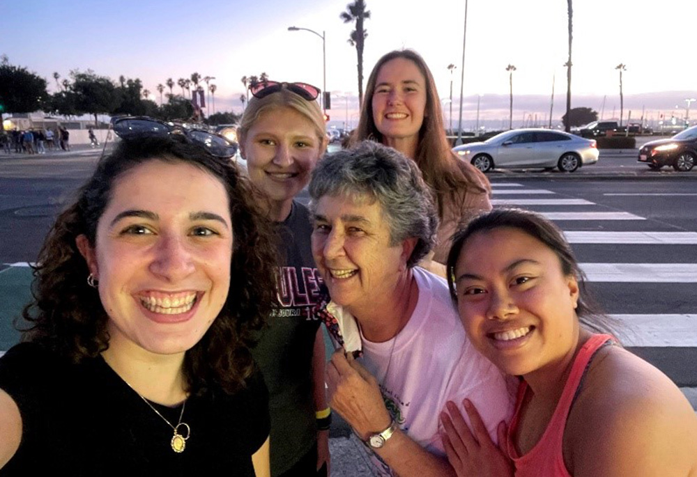 From left: Nina Dorsett, Emily Michaelis, Sr. Louise Ann Micek, Emma Shay, and I are pictured in a selfie. We ate at a restaurant in downtown San Diego after our service with migrants to reflect about our experiences. (Courtesy of Sisters of St. Joseph)