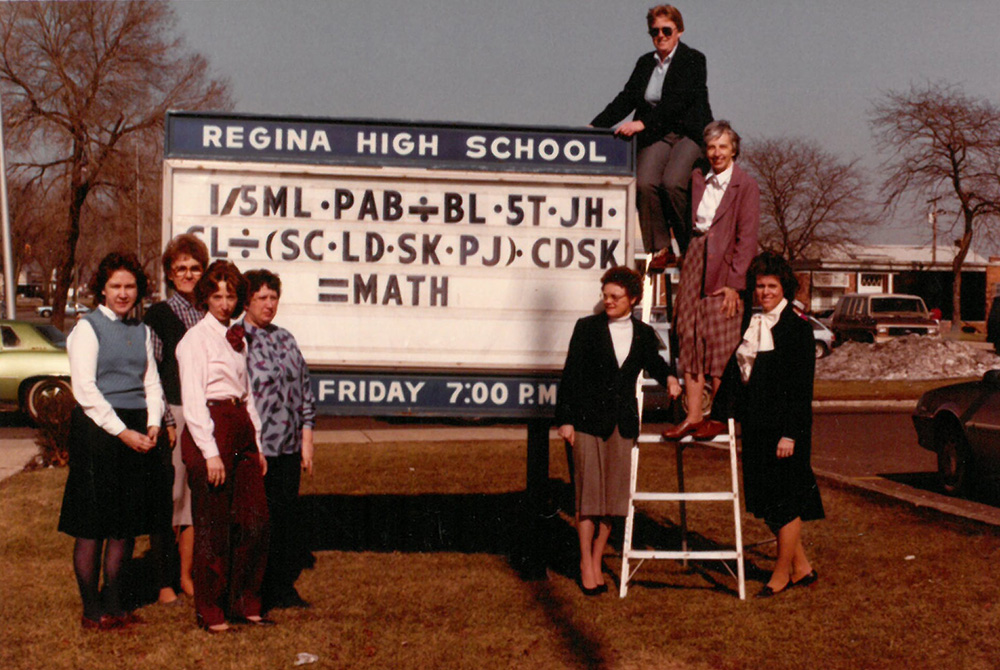 Jane Herb yearbook photo, 1984 A picture from Regina High School's 1984 yearbook, when Sr. Jane Herb (top right, on ladder) was chair of the math department. The department members used their initials in an equation to spell out "MATH." (Courtesy of Jane Herb)