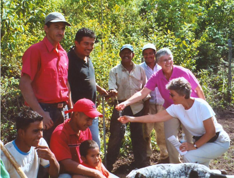 Sisters of St. Francis of Dubuque, Iowa, rejoice with villagers at the site of the first completed Sister Water Project in Honduras in 2007.