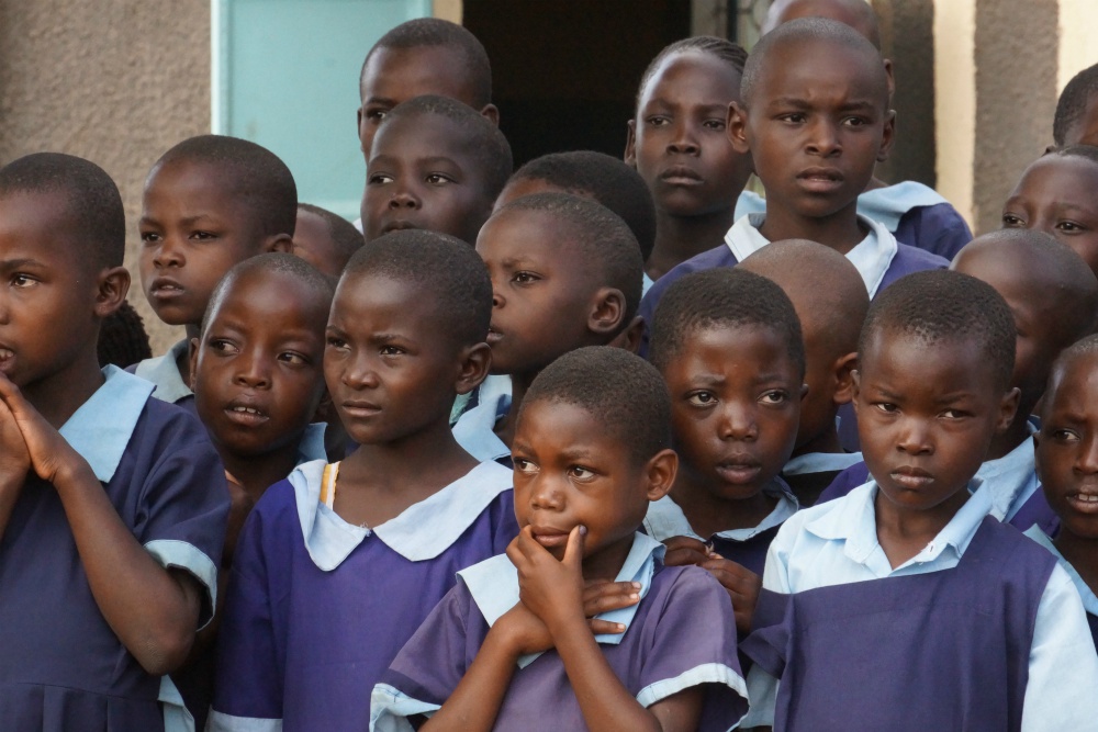 Kenyan schoolchildren listen to their teacher in June 2019 outside their classroom in Bungoma in western Kenya. According to UNESCO, the education of 1.54 billion pupils in 185 countries has been curtailed during the pandemic. (Doreen Ajiambo) Kenyan schoolchildren listen to their teacher in June 2019 outside their classroom in Bungoma in western Kenya. According to UNESCO, the education of 1.54 billion pupils in 185 countries has been curtailed during the pandemic. (Doreen Ajiambo)
