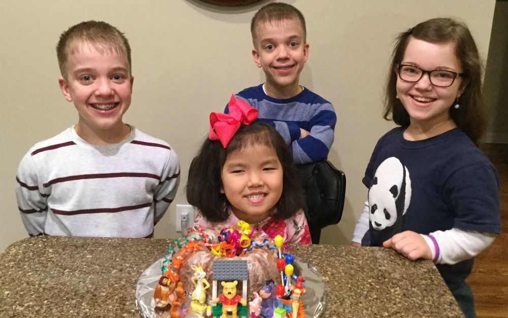 The Worley children get ready for Christmas together with a gingerbread house.