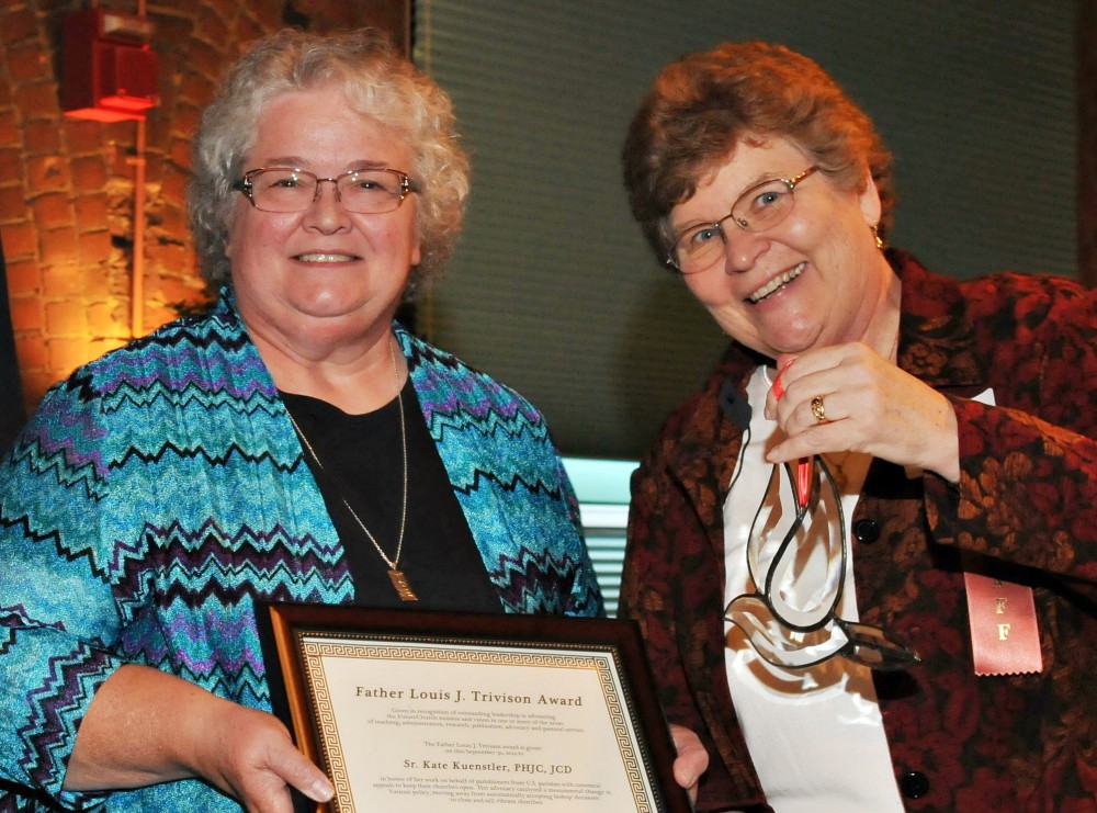 Sr. Kate Kuenstler of the Poor Handmaids of Jesus Christ, left, seen with St. Joseph Sr. Christine Schenk, receives FutureChurch's Rev. Louis J. Trivison Award in fall 2012. (Courtesy of FutureChurch)