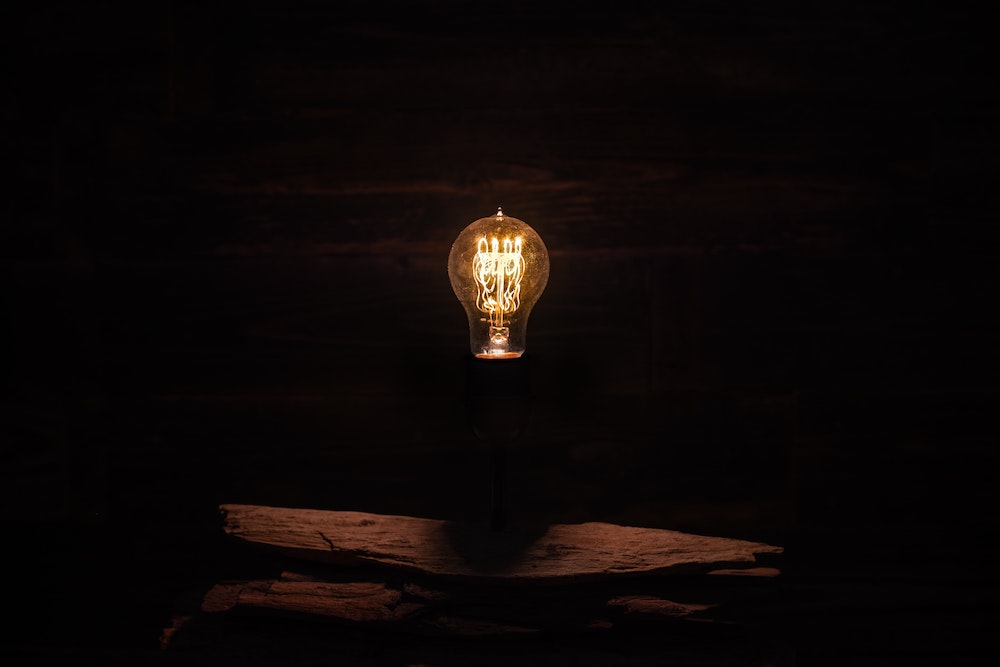 Lightbulb photo illustration (Unsplash/Timothy Perry)