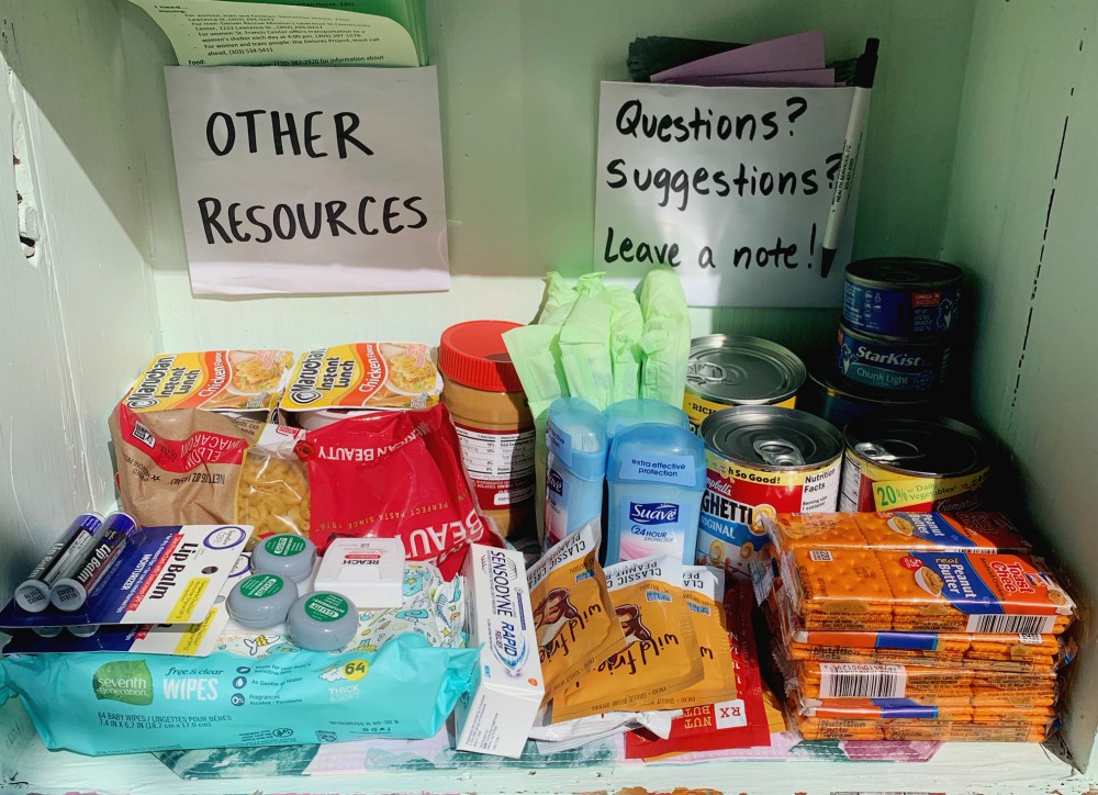 The Little Free Pantry in front of the Denver Loretto Volunteer House is stocked with dry food products and personal hygiene products like deodorant, menstrual care items, toothpaste and wipes. (Ali Alderman)