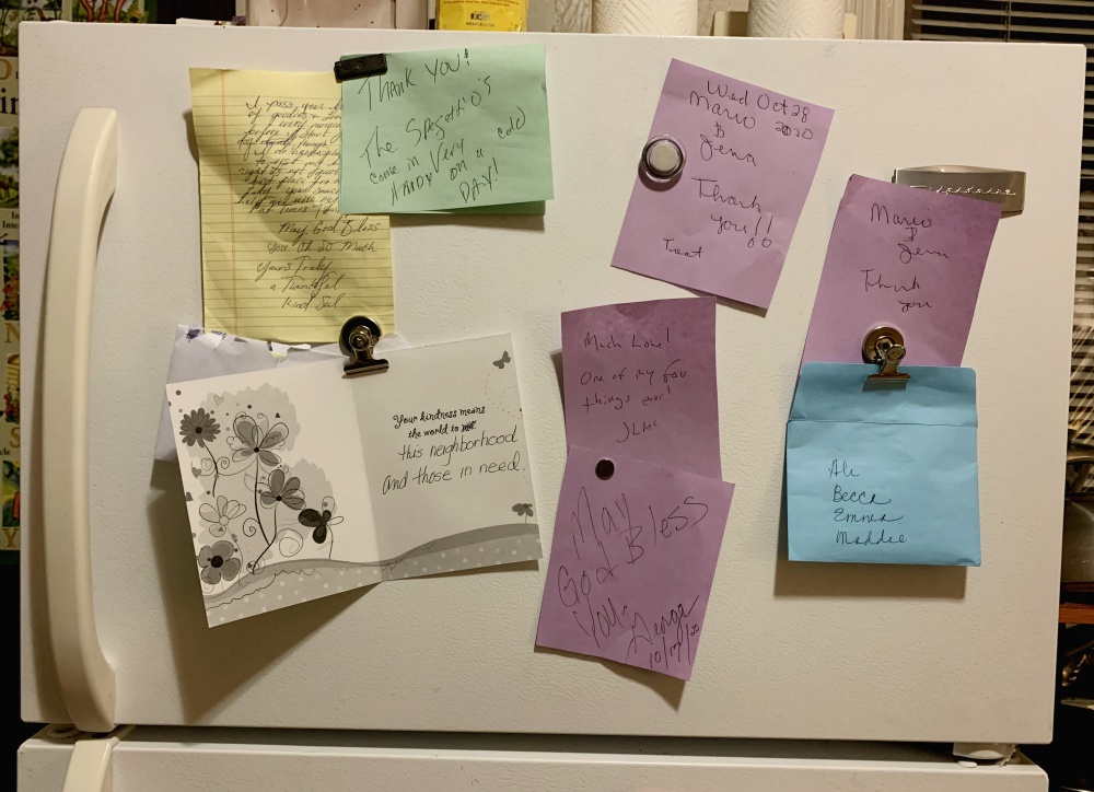 The Denver Loretto Volunteer House fridge is covered in notes from patrons and supporters of the Little Free Pantry. (Ali Alderman)