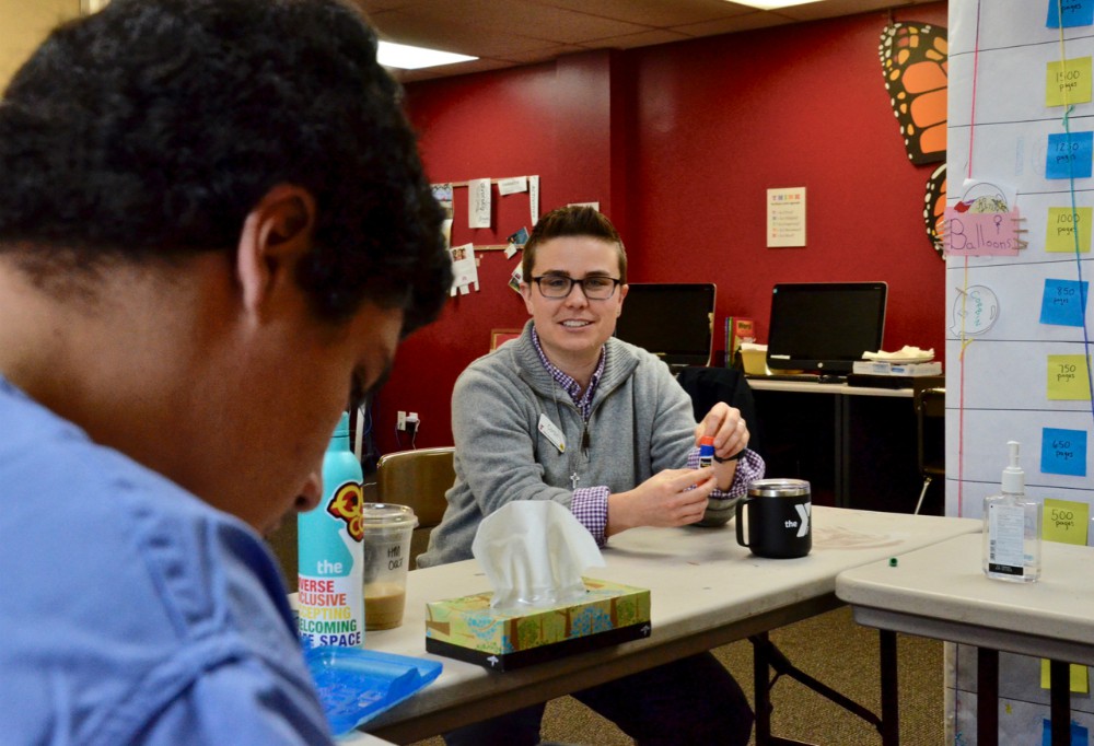 Troy (not his real name), left, is a client at YMCA Safe Place Services in Louisville, Kentucky, where Providence Sr. Corbin Hannah, right, is youth development coordinator. (GSR photo / Dan Stockman) Troy (not his real name), left, is a client at YMCA Safe Place Services in Louisville, Kentucky, where Providence Sr. Corbin Hannah, right, is youth development coordinator. (GSR photo / Dan Stockman)