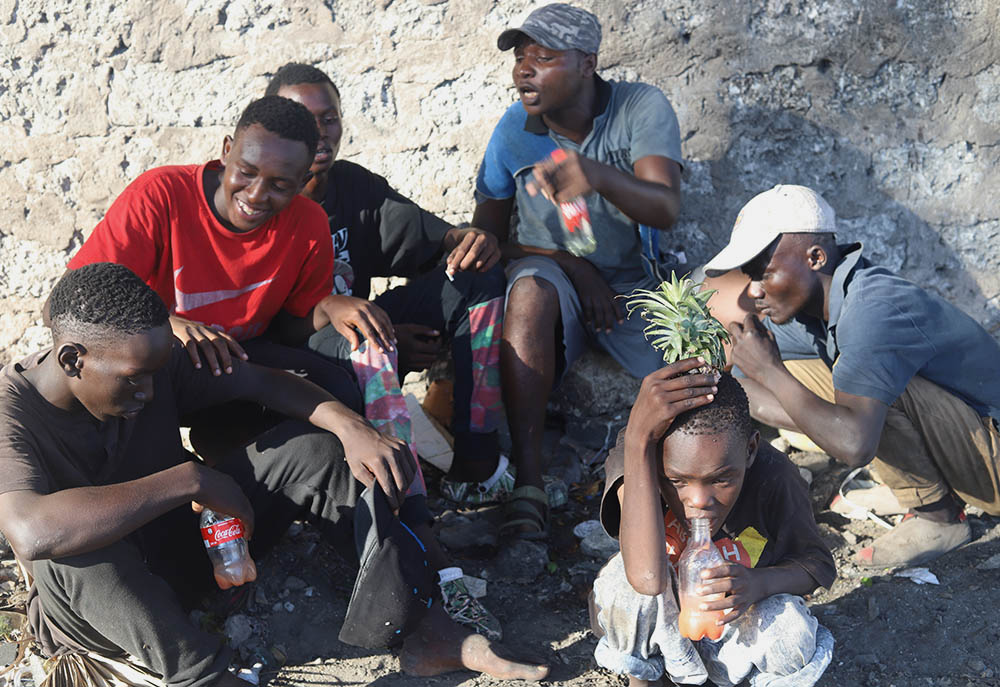 Youths meet for their daily dose of heroin, cocaine and other drug substances in Kenya's coastal region on the Indian Ocean. Addiction has become rife and is visibly affecting the lives of youths in the tourist region.