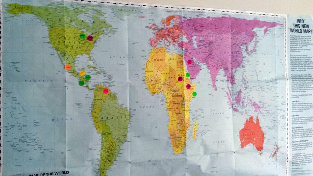 A map of the world in Bethany House of Hospitality in Bartlett, Illinois, features stickers that show the places of origin of those who live and work there.
