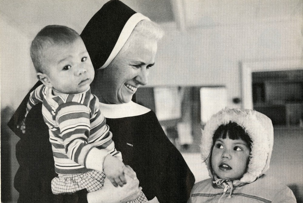 St. Joseph Sr. Mary Christine Taylor, a Sister of St. Joseph of Watertown, New York, with two children from the Mohawk Tribe on the St. Regis Mohawk Reservation in 1984 (Courtesy of Catholic Extension Magazine) St. Joseph Sr. Mary Christine Taylor, a Sister of St. Joseph of Watertown, New York, with two children from the Mohawk Tribe on the St. Regis Mohawk Reservation in 1984 (Courtesy of Catholic Extension Magazine)
