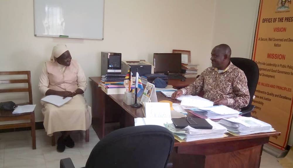 Sr. Mary Grace Akiror questions Lt. Col. James Mwesigye, the Mbarara District resident district commissioner, on the progress of government programs and corruption-related issues. (Gerald Matembu)