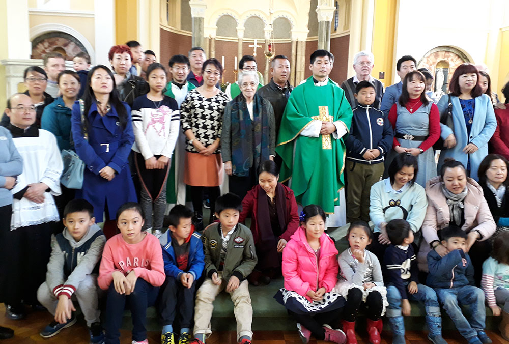 Members of the Chinese diaspora in Dublin with Columban Sr. Mary Greaney, center, and Fr. Anthony Hau, the chaplain to the Chinese community from China, in 2017 (Courtesy of Sr. Mary Greaney)