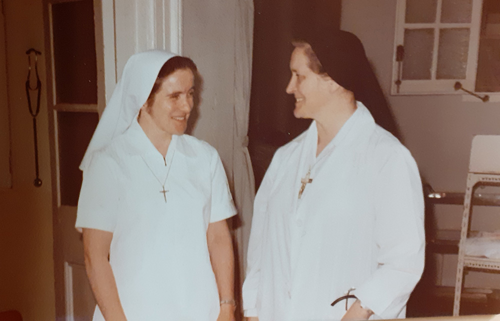 In 1978, Columban Sr. Mary Greaney, left, speaks to Columban Sr. Mary Aquinas Monaghan, who was the medical director at Ruttonjee Sanatorium for almost 40 years. In 1978, Columban Sr. Mary Greaney, left, speaks to Columban Sr. Mary Aquinas Monaghan, who was the medical director at Ruttonjee Sanatorium for almost 40 years.