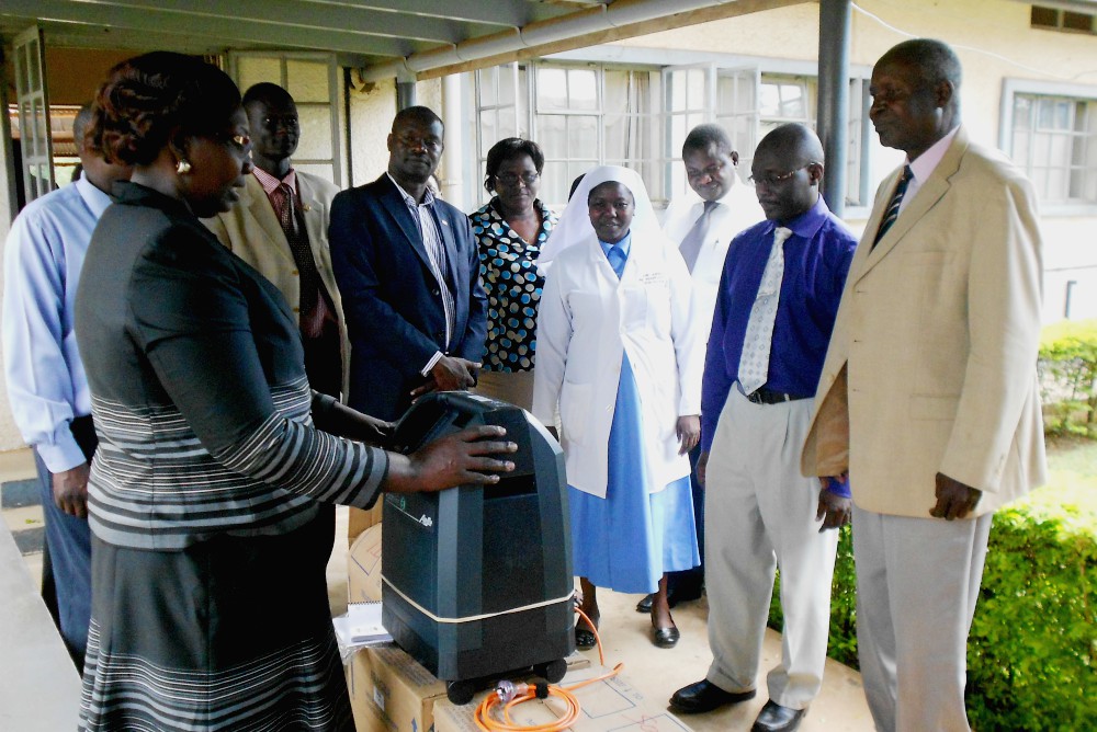 Sr. Mary Margaret Ajiko hands over oxygen concentrators to hospital management at Soroti Regional Referral Hospital. (Gerald Matembu)