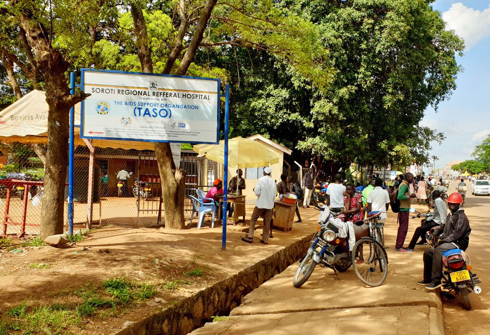 People wait outside at Soroti Regional Referral Hospital in Soroti, Uganda. (Gerald Matembu)