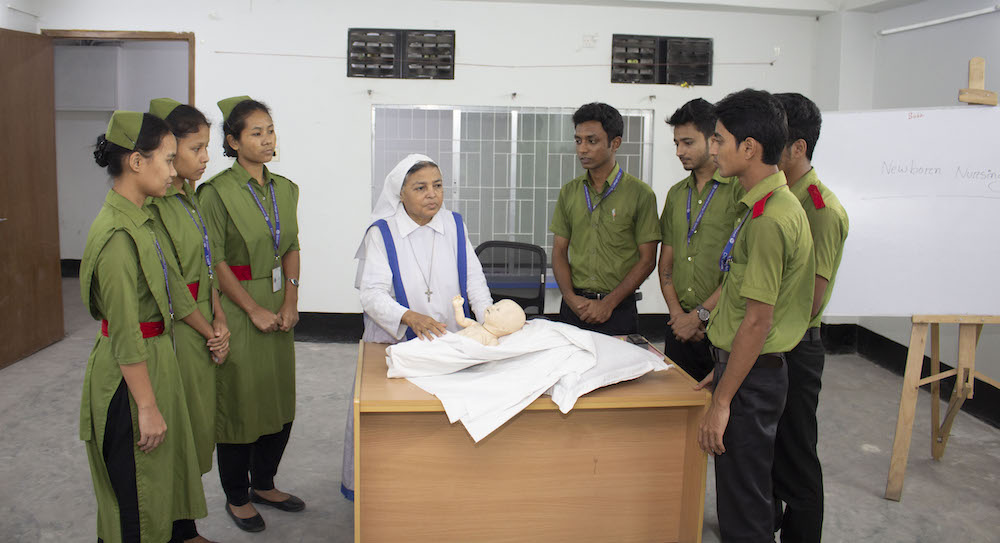 Sr. Mary Nibedita of the Associates of Mary, Queen of Apostles does a demonstration about taking care of newborns with her students from the Universal Medical College and Hospital.