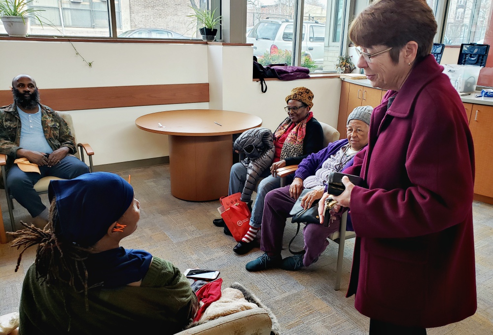 Mercy Sr. Mary Scullion, one of the co-founders of Project HOME in Philadelphia, meets clients at a Project HOME medical facility in December. (GSR photo/Chris Herlinger)