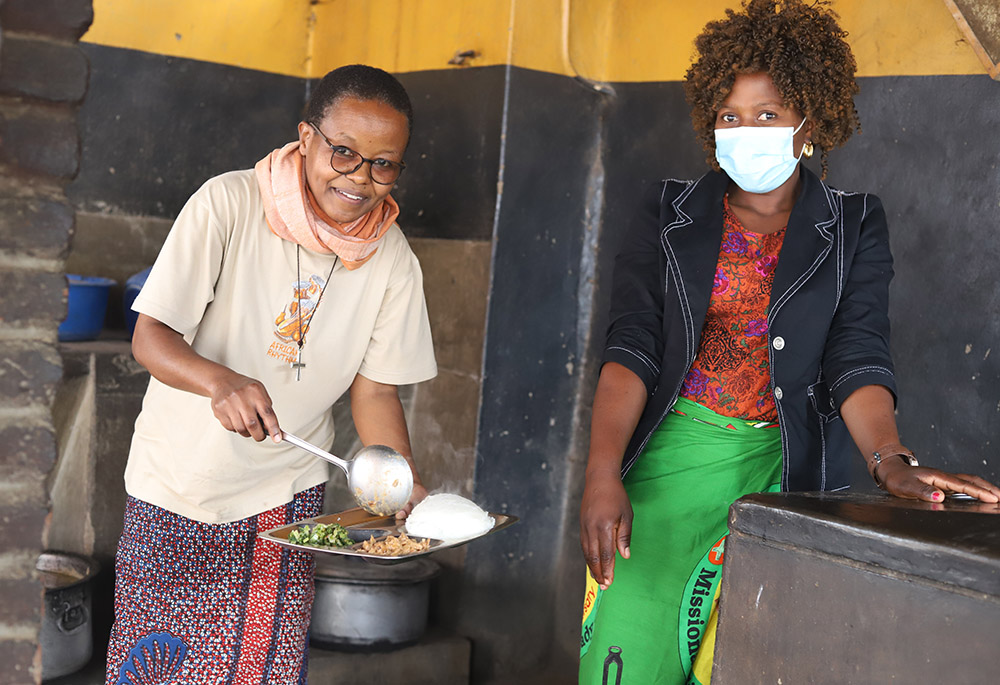 Sr. Anna Masawe serves food to a staff member at the Tikondane care center. (GSR photo/Doreen Ajiambo) Sr. Anna Masawe serves food to a staff member at the Tikondane care center. (GSR photo/Doreen Ajiambo)