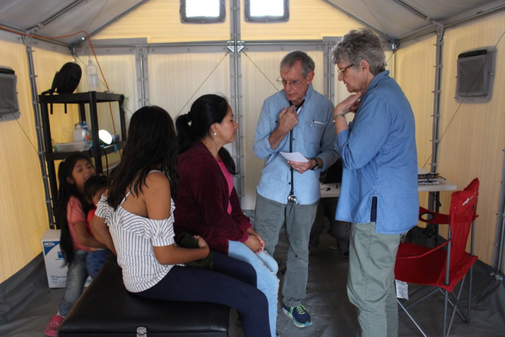 Sr. Mary Alice helps with translation at a clinic at the Matamoros camp. Many of the residents suffer from illness and stress-related health issues. (GSR photo / Tracy L. Barnett)