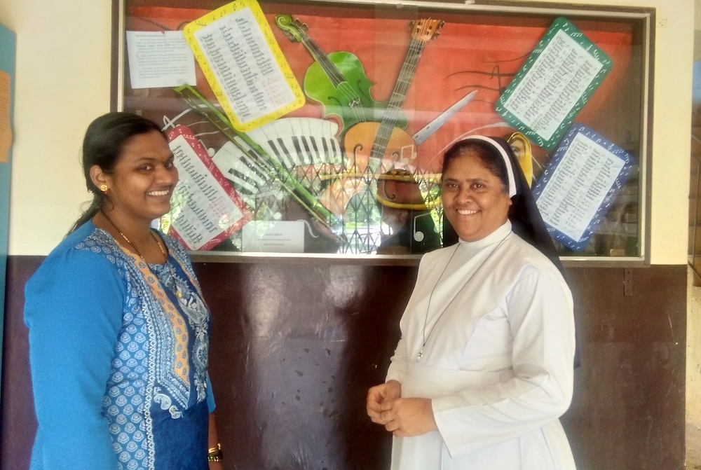 Sr. Meena Dias, a member of the Sisters of Holy Family of Nazareth, right, with Vandana Kawlekar, a staff member at St. Xavier's Academy, which cares for children with disabilities in Old Goa, ancient capital of Portuguese Goa (Lissy Maruthanakuzhy)
