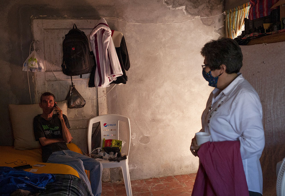 Sr. Mercedes Castillo, left, greets Osmani Pedro Perez, of Cuba, at the El Buen Samaritano shelter in Nuevo Laredo, Mexico on March 27. (Nuri Vallbona)