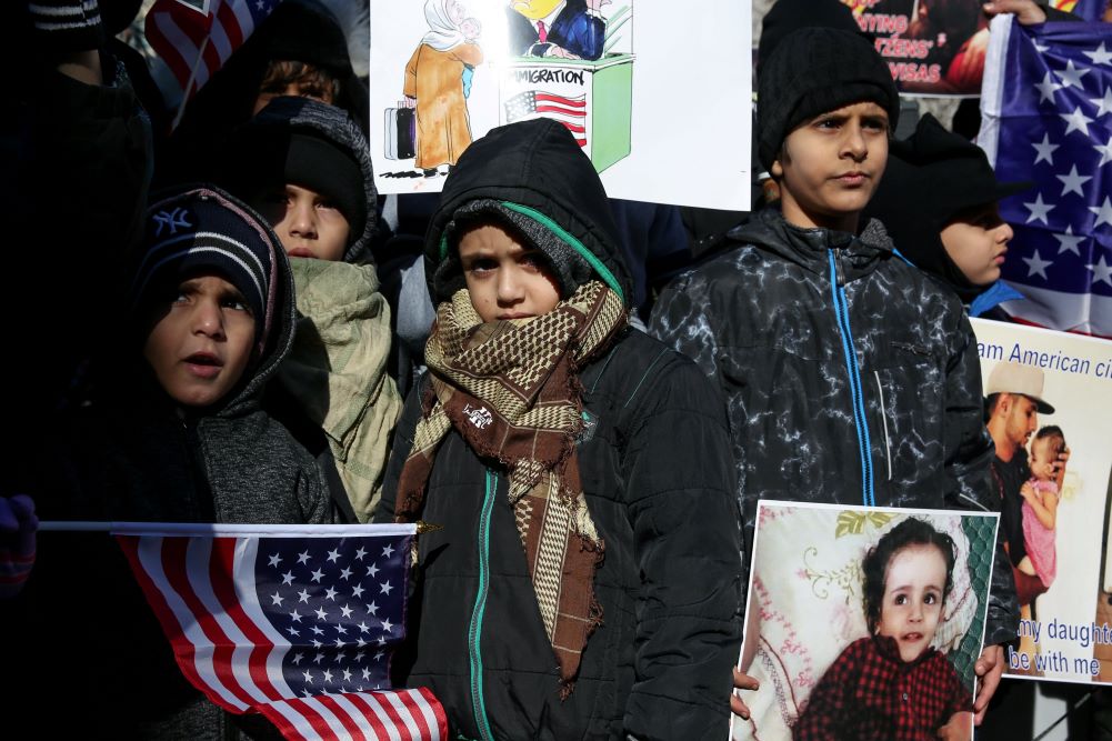 Yemeni Americans in New York City demonstrate in December against then-President Donald Trump's travel ban and denials of visa applications (CNS/Reuters/Amr Alfiky).