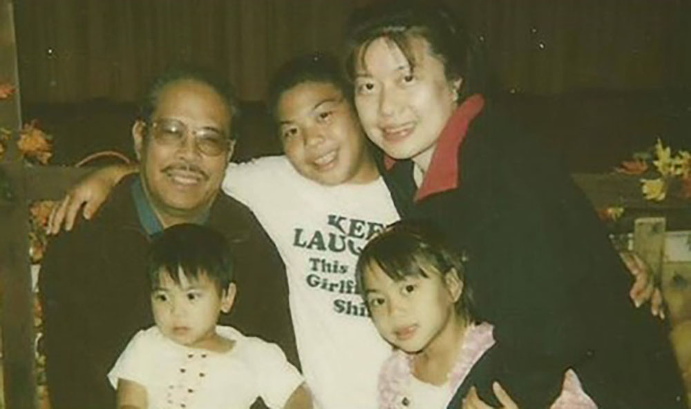 My family in 2006. From left: Osmundo Evangelista Jr. (my papa), holding Jenalyn Evangelista (my baby sister); Joseph Evangelista (my older brother); and Maria Ignacio (my mom), holding me. (Courtesy of Jaesen Evangelista)