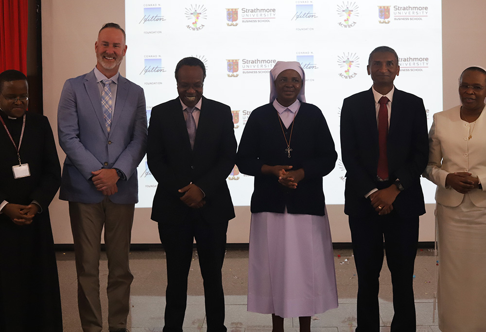 Officials pose for a photo after officially launching the next phase of the Sisters' Blended Value Project on April 27 at Strathmore University Business School in Nairobi, Kenya. (Wycliff Oundo)