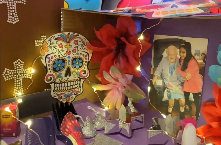 A student shares her ofrenda altar in memory of her grandmother during a Dia de los Muertos virtual gathering of the Incarnate Word family last fall. (Screenshot by Martha A. Kirk)