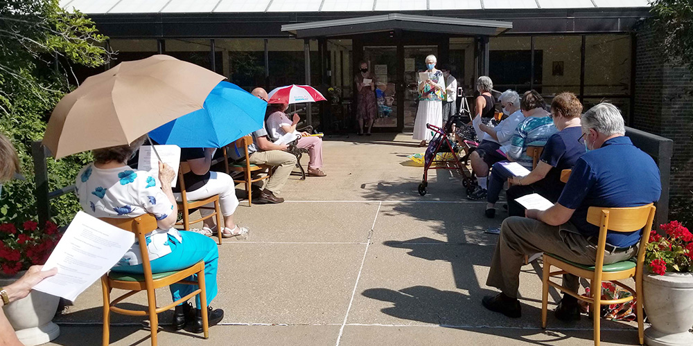The Congregation of the Humility of Mary held a masked and socially distanced welcoming ceremony outdoors and on Zoom for four new associates in August 2020. (Courtesy of the Congregation of the Humility of Mary)