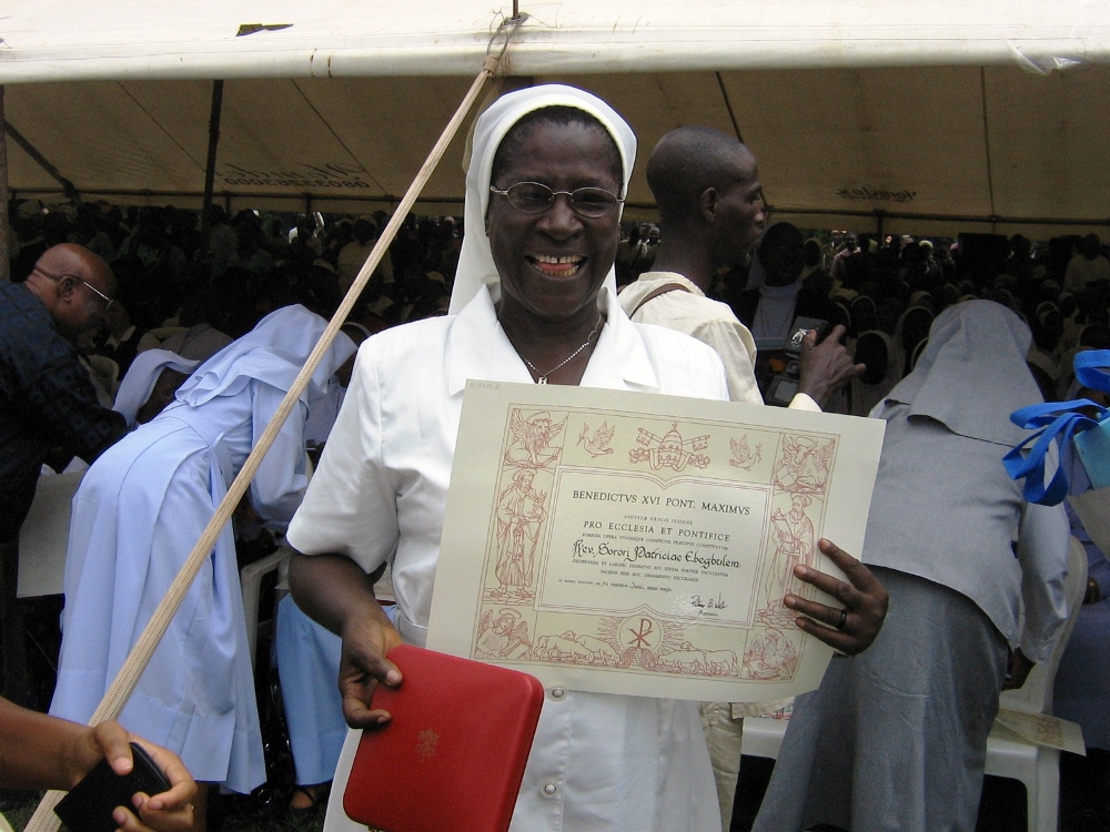 Sr. Patricia Ebegbulem holds her certificate at an award ceremony in 2012 where she received the Pro Ecclesia et Pontifice medal. (Provided photo)