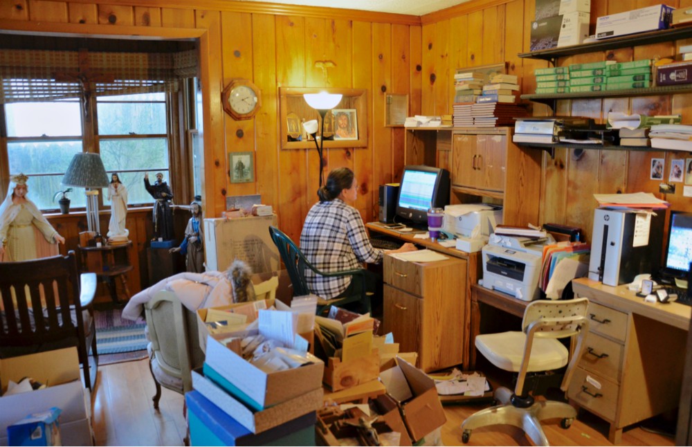 A volunteer works in the office of the Confraternity of Penitents in Fort Wayne, Indiana, a private association of the faithful featured in the 2017 edition of "Emerging U.S. Communities of Consecrated Life Since Vatican II." (GSR photo / Dan Stockman)