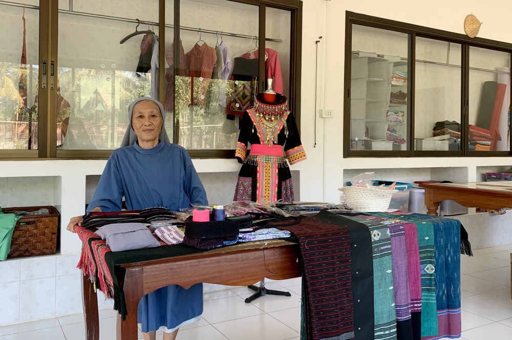 Sr. Manivong Phasangkhonesy shows some of the fine clothes made in the Nazareth Center's sewing shop. (Akarath Soukhaphon) Sr. Manivong Phasangkhonesy shows some of the fine clothes made in the Nazareth Center's sewing shop. (Akarath Soukhaphon)